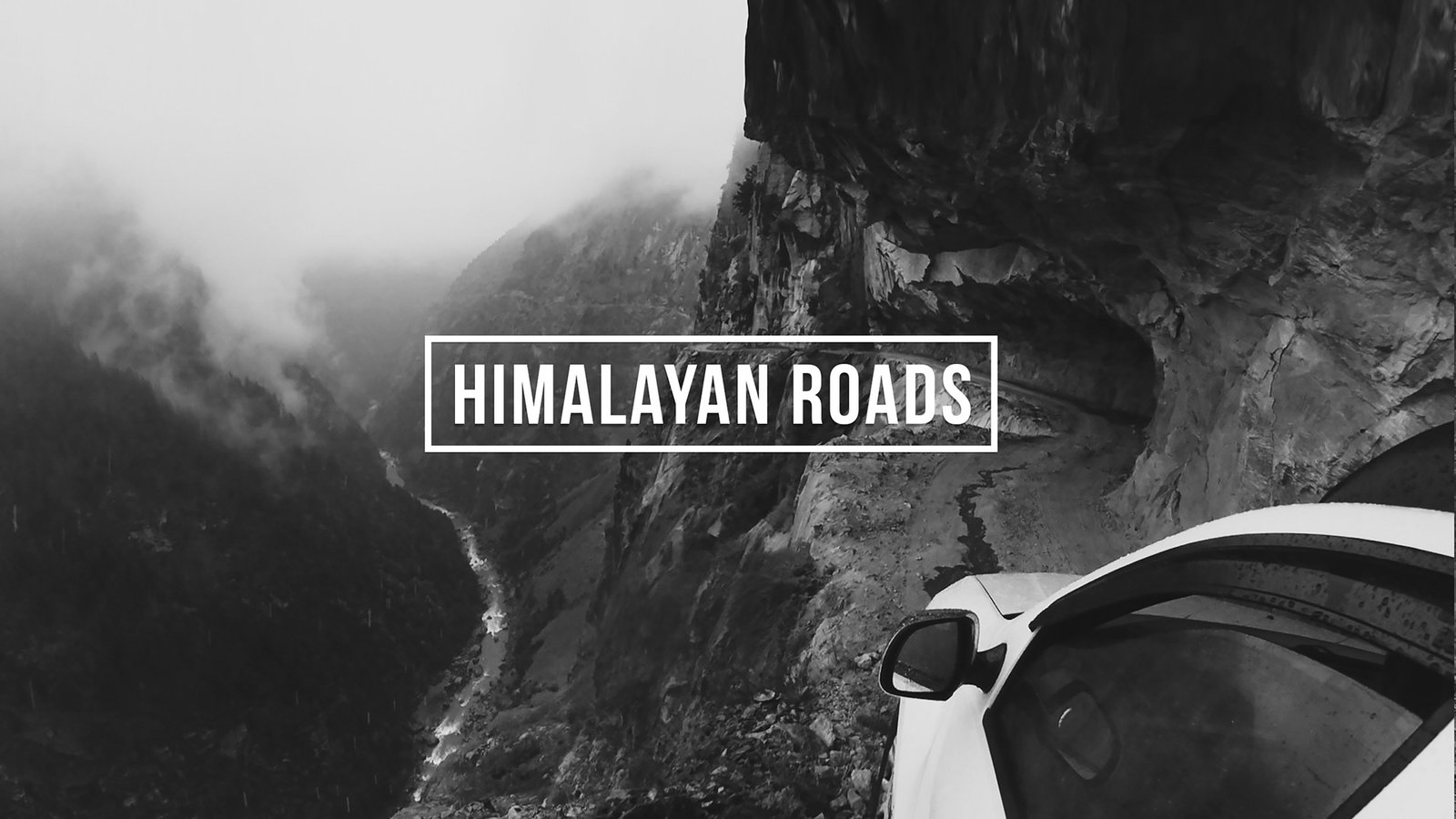 A misty Himalayan cliff road with the Himalayan Roads wordmark